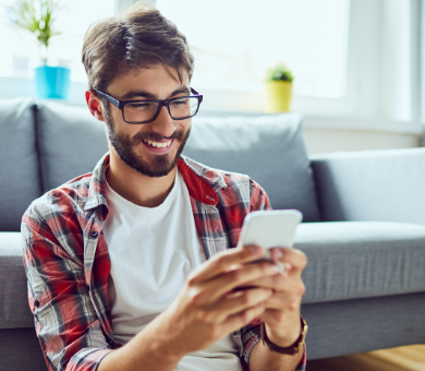 Happy guy using phone